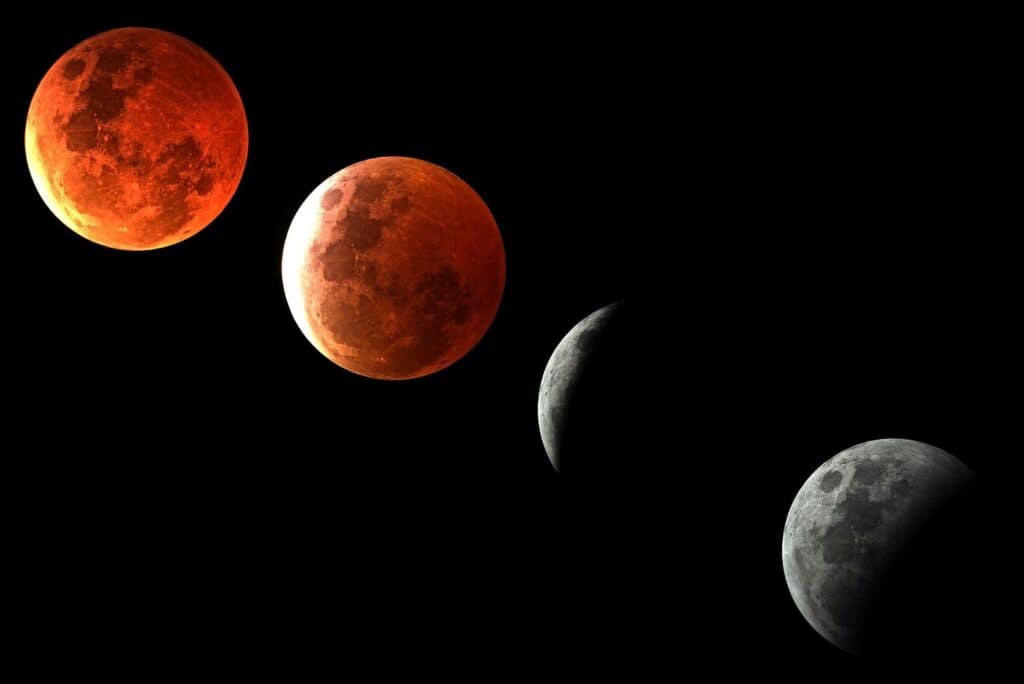 Phases of a lunar eclipse against a black sky