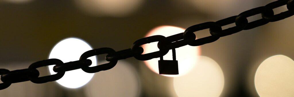 A close up of a chain with a padlock on it