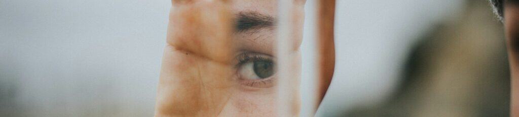 shallow focus of person holding mirror