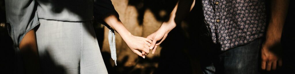 man and woman holding hands