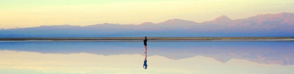 person standing near body of water during daytime