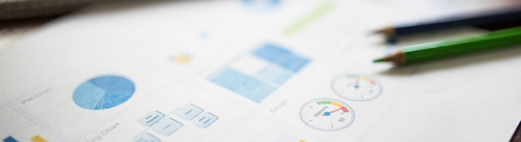 Illustration of a business financial report featuring various charts and graphs on paper.