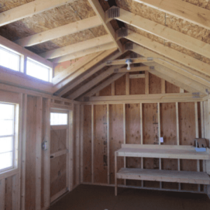 Interior view of a standard wooden shed with unfinished walls and ceiling, ideal for storage or DIY.