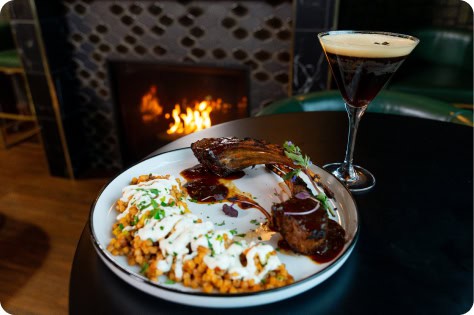 Delicious comfort food platter with ribs, mashed potatoes, and gravy at Attwood's Kitchen & Drink.