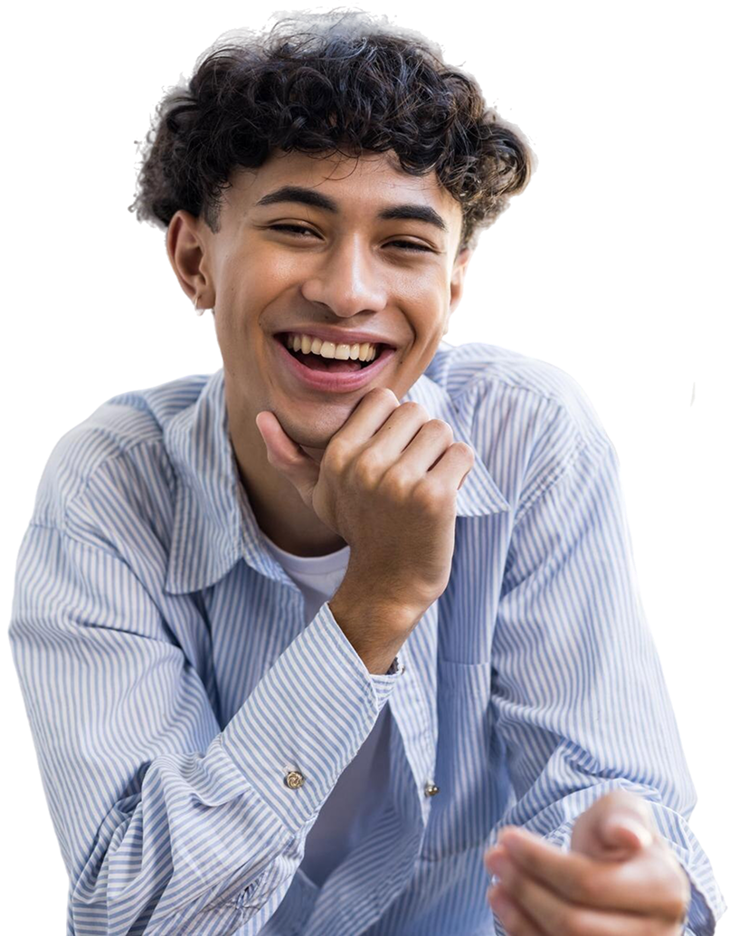 smiling teenage boy sitting couch home looking relaxed happy 1 e1767084963755