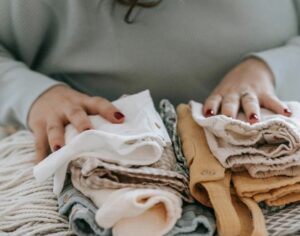 when can i wash baby clothes with mine