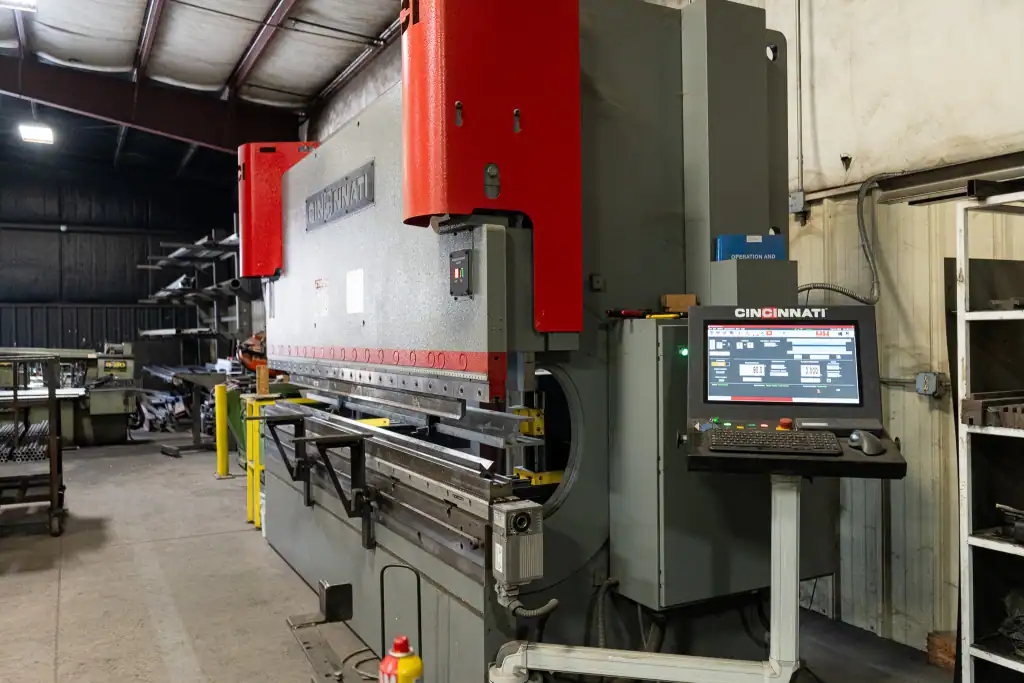 Industrial powder coating machine at B&B Metals Fabrication.