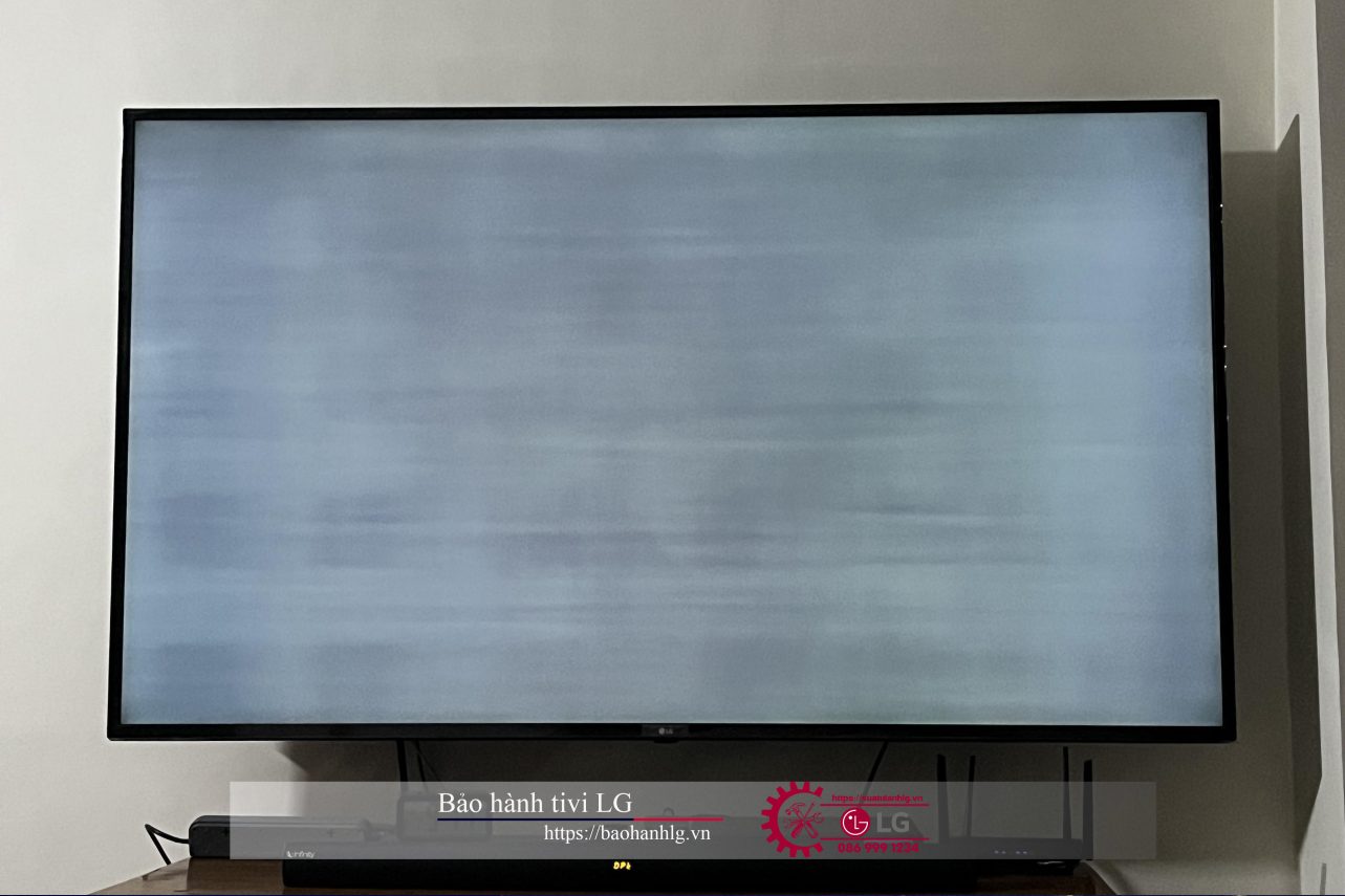 LG television with warranty services, black flat-screen, displayed on wall for LG TV warranty support, ideal for home entertainment and electronics repair.