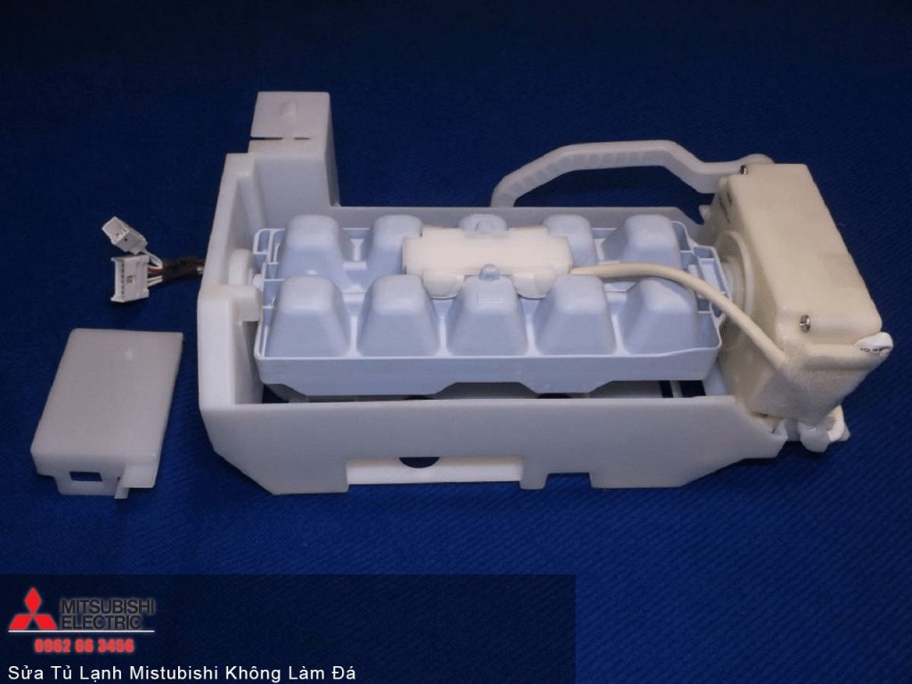 White Mitsubishi electric refrigerator compressor component for vehicle cooling systems.