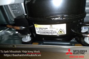 Refrigerant compressor for Mitsubishi electric refrigerators with black body and copper pipes, maintenance and repair services.