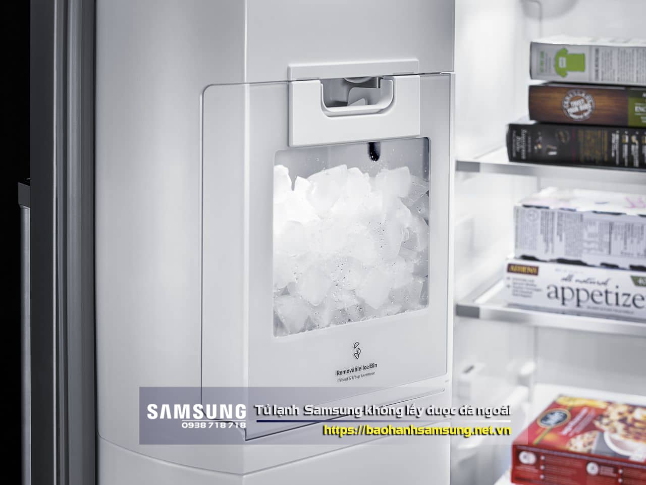 Ice maker bin inside Samsung refrigerator for maintenance and warranty services in Vietnam.