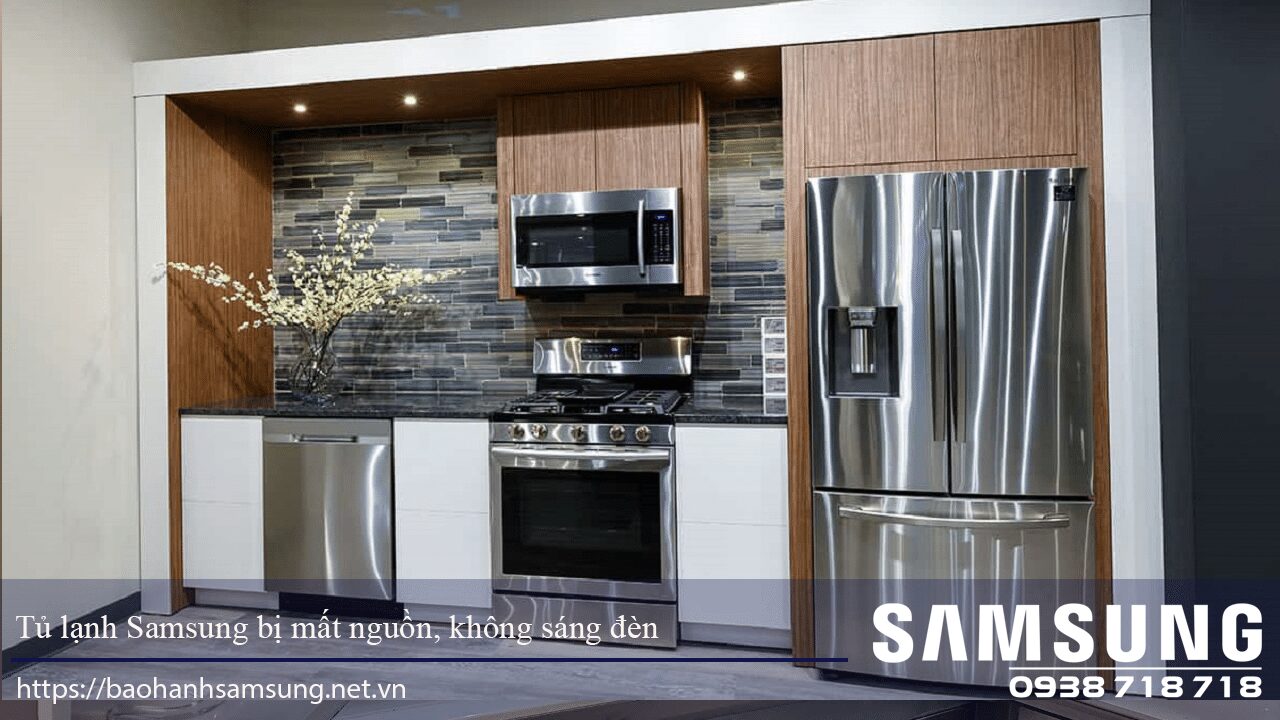 Stainless steel Samsung refrigerator with broken power supply and no light inside in modern kitchen setting.