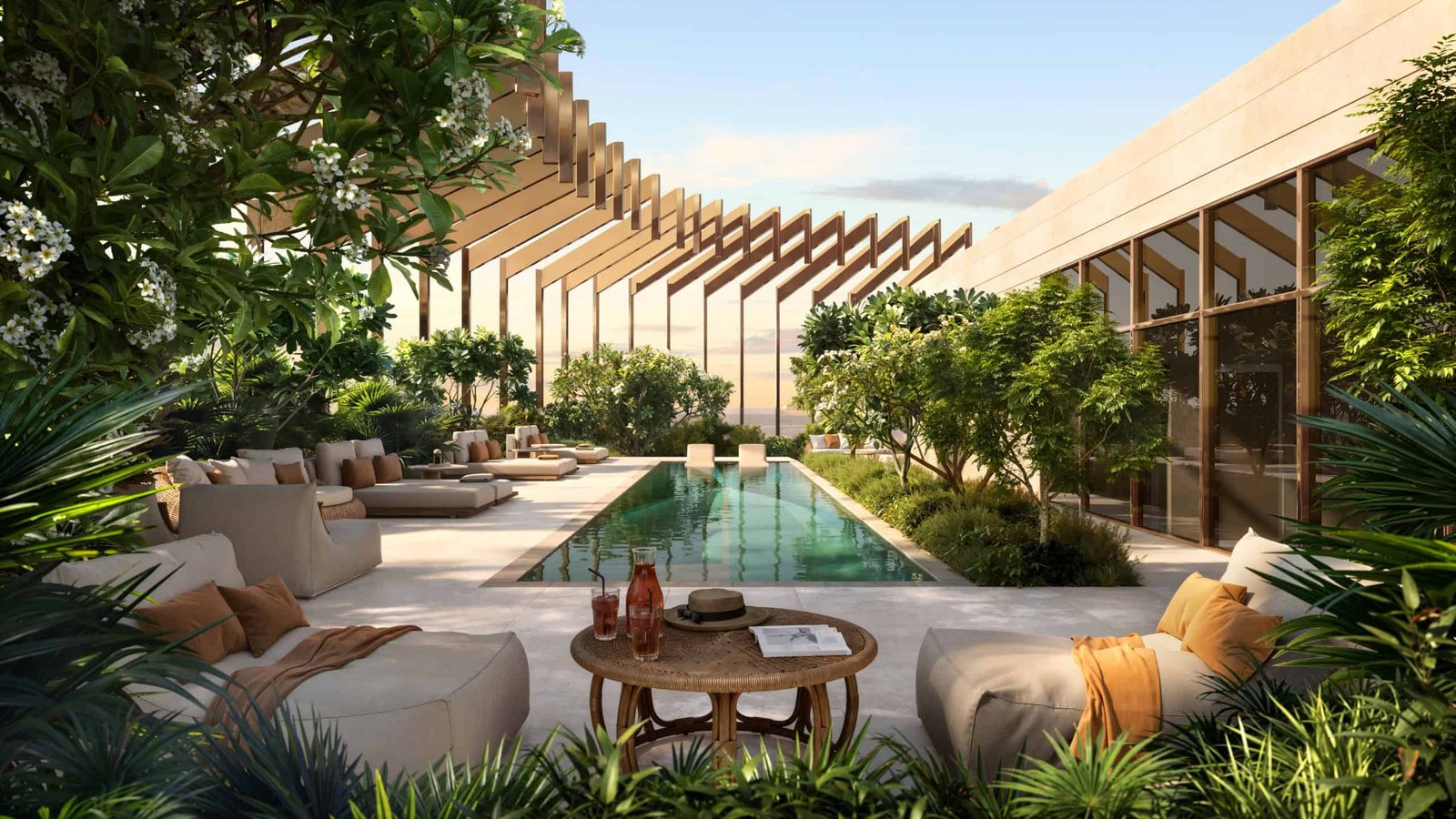 Elegant outdoor lounge area with pool and lush greenery at Kanyon by Beyond Dubai.
