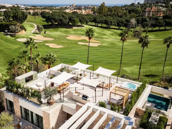 Luxury golf course villa with private pool and terrace in a scenic setting.