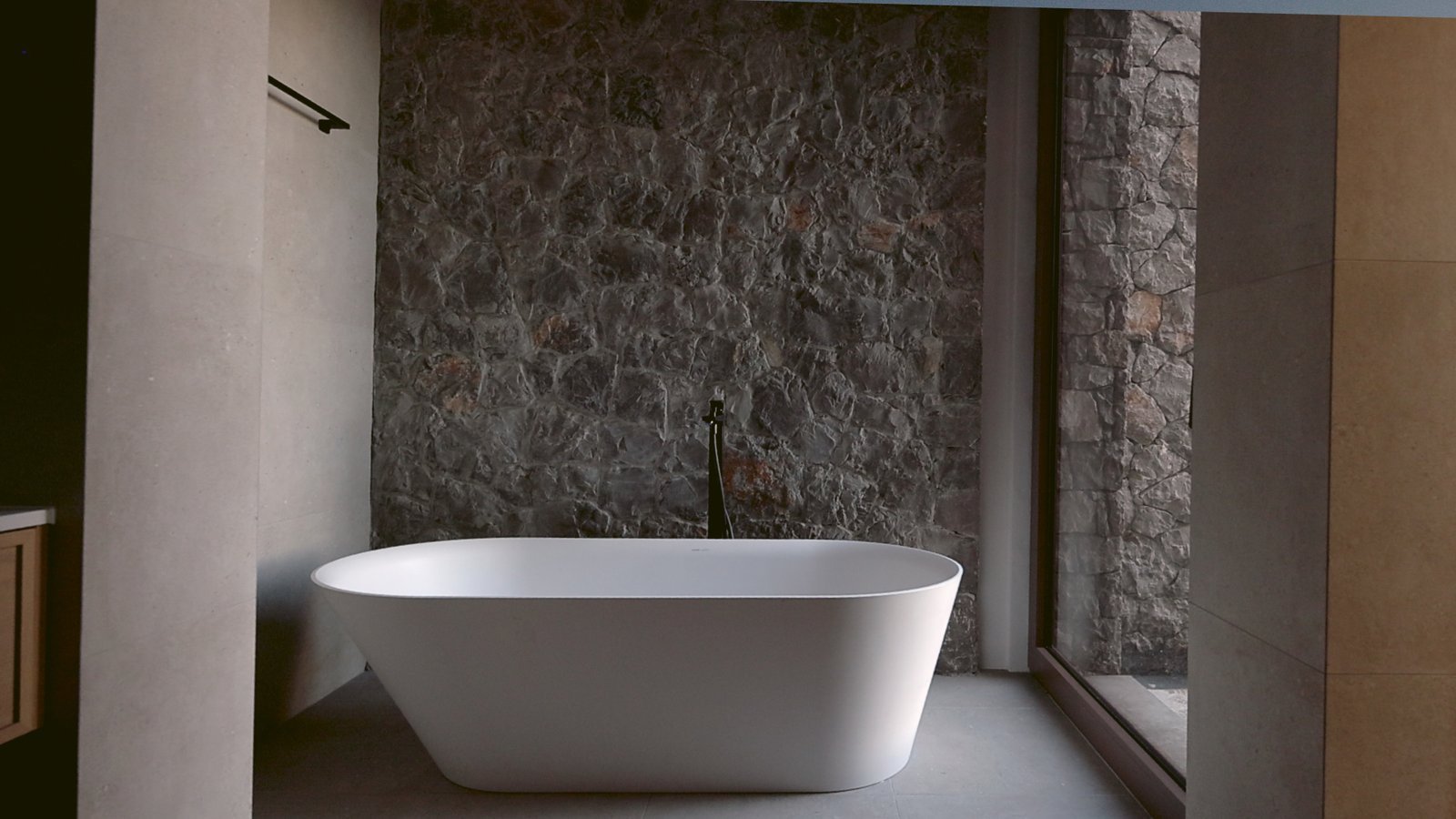 Elegant freestanding bathtub with sea view in Montenegro luxury villa.