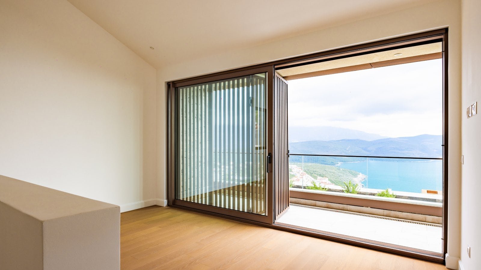 Sea view luxury villa in Montenegro with spacious balcony and modern interior.