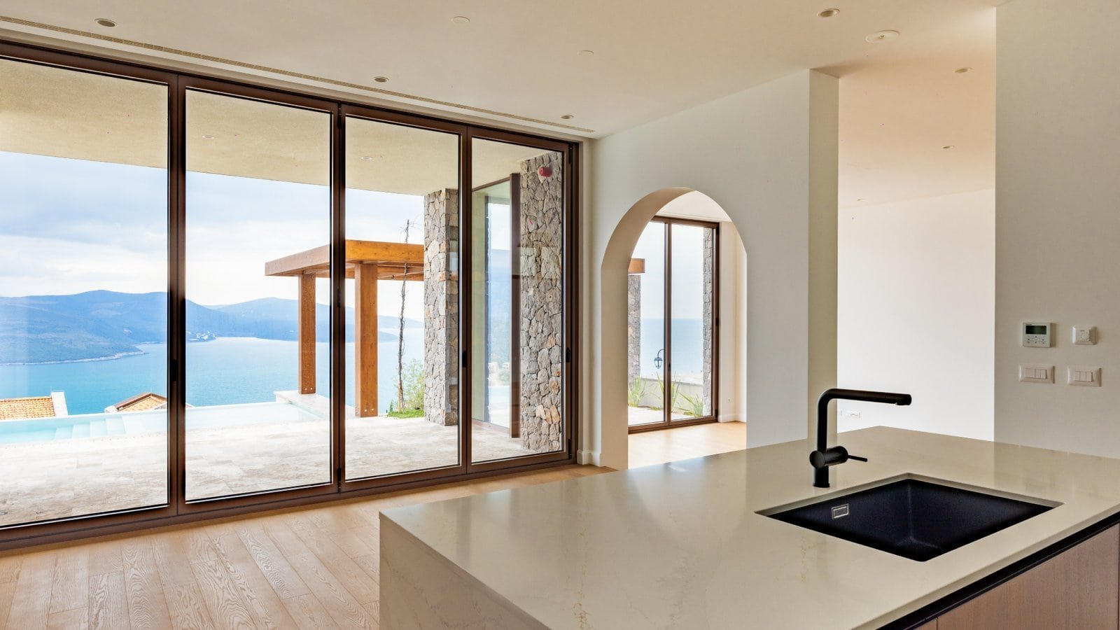 Elegant interior of a luxury villa with panoramic sea views in Montenegro.