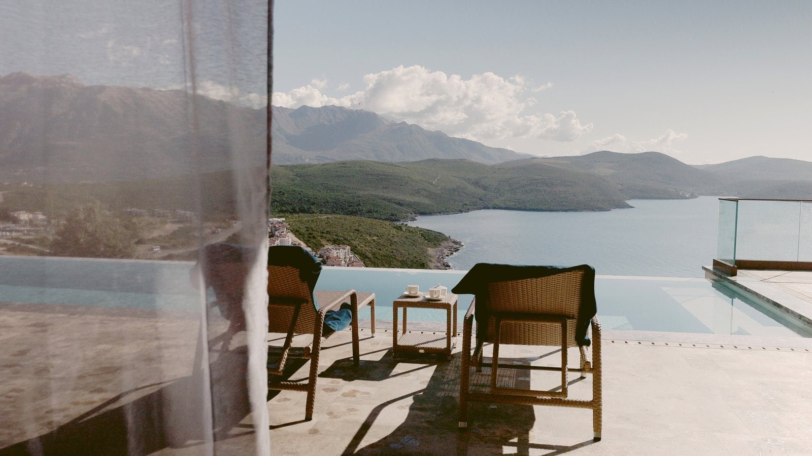 Stunning sea view luxury villas in Montenegro with infinity pool and mountain backdrop.