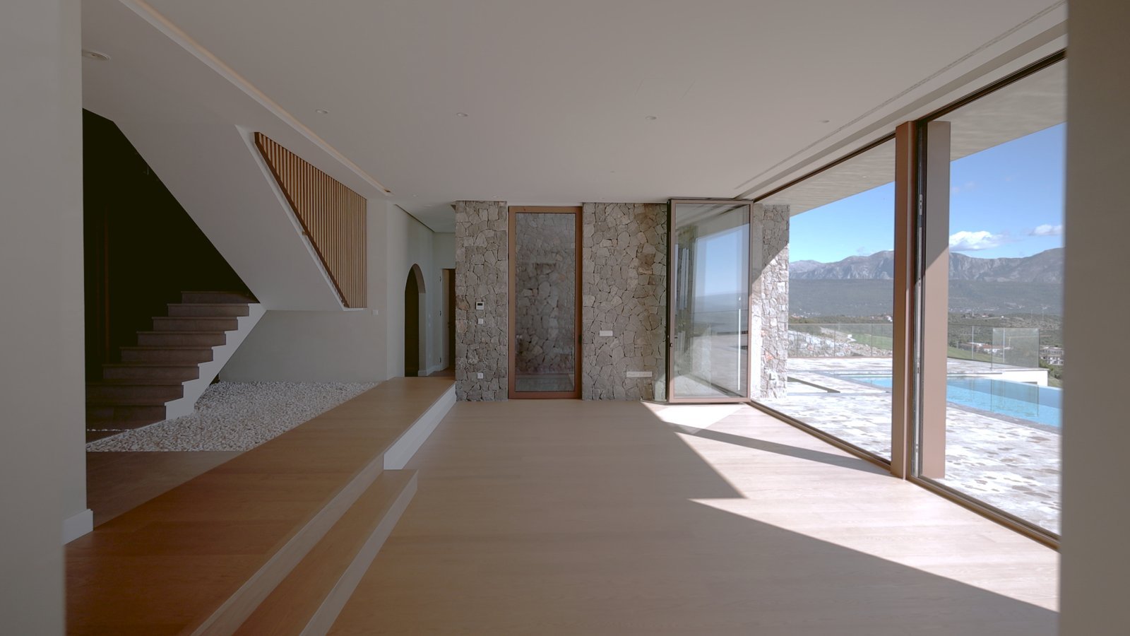 Modern luxury villa interior with panoramic sea views in Montenegro.