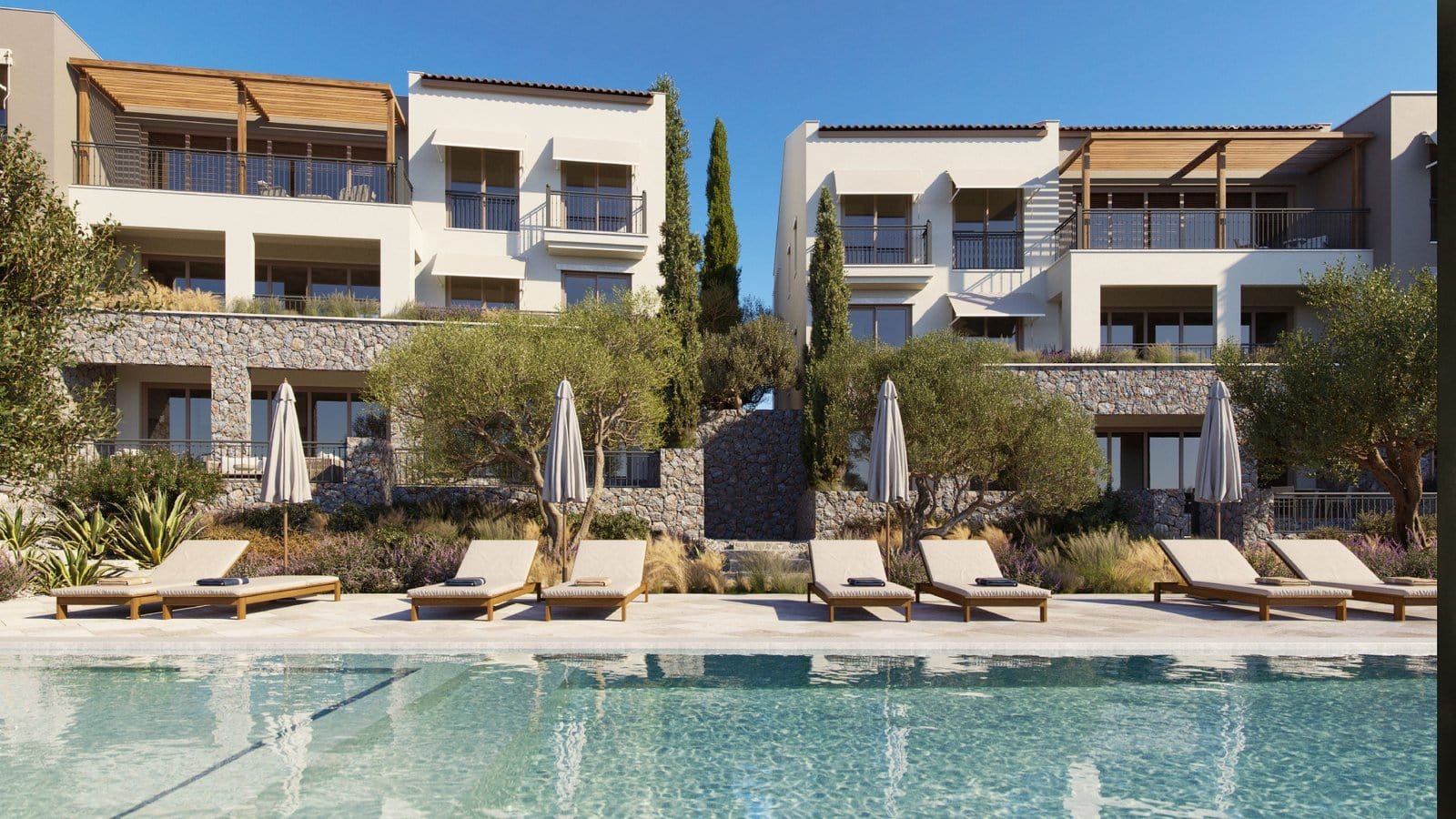 Luxurious villa featuring a large swimming pool, modern design, and spacious outdoor lounging areas.