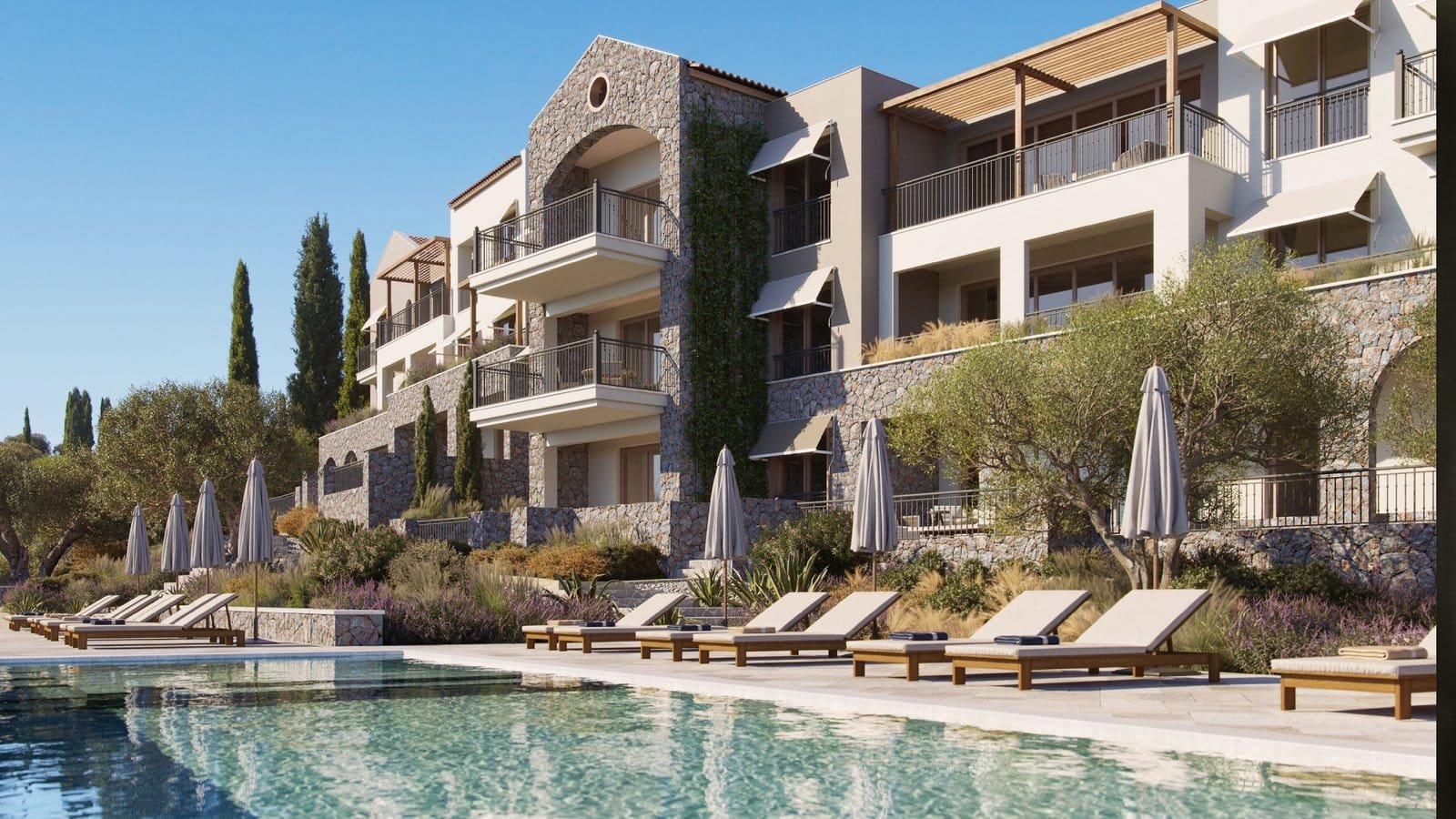 Luxury Mediterranean-style apartment complex with pool and outdoor lounging areas.