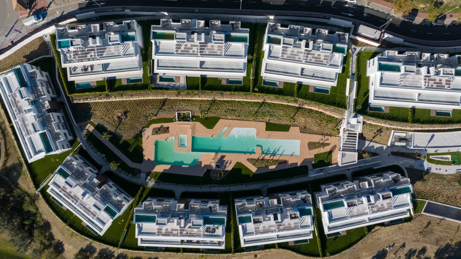 Aerial view of Santa Clara Golf Apartments Marbella with frontline golf course access. Modern reside.