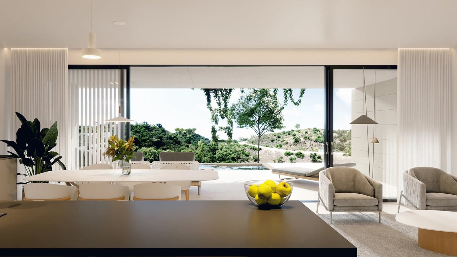 Bright living room in Marbella with large glass windows and scenic outdoor views.