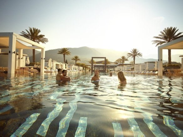 Luxury pool with guests enjoying the water at Barok Estates International resort.