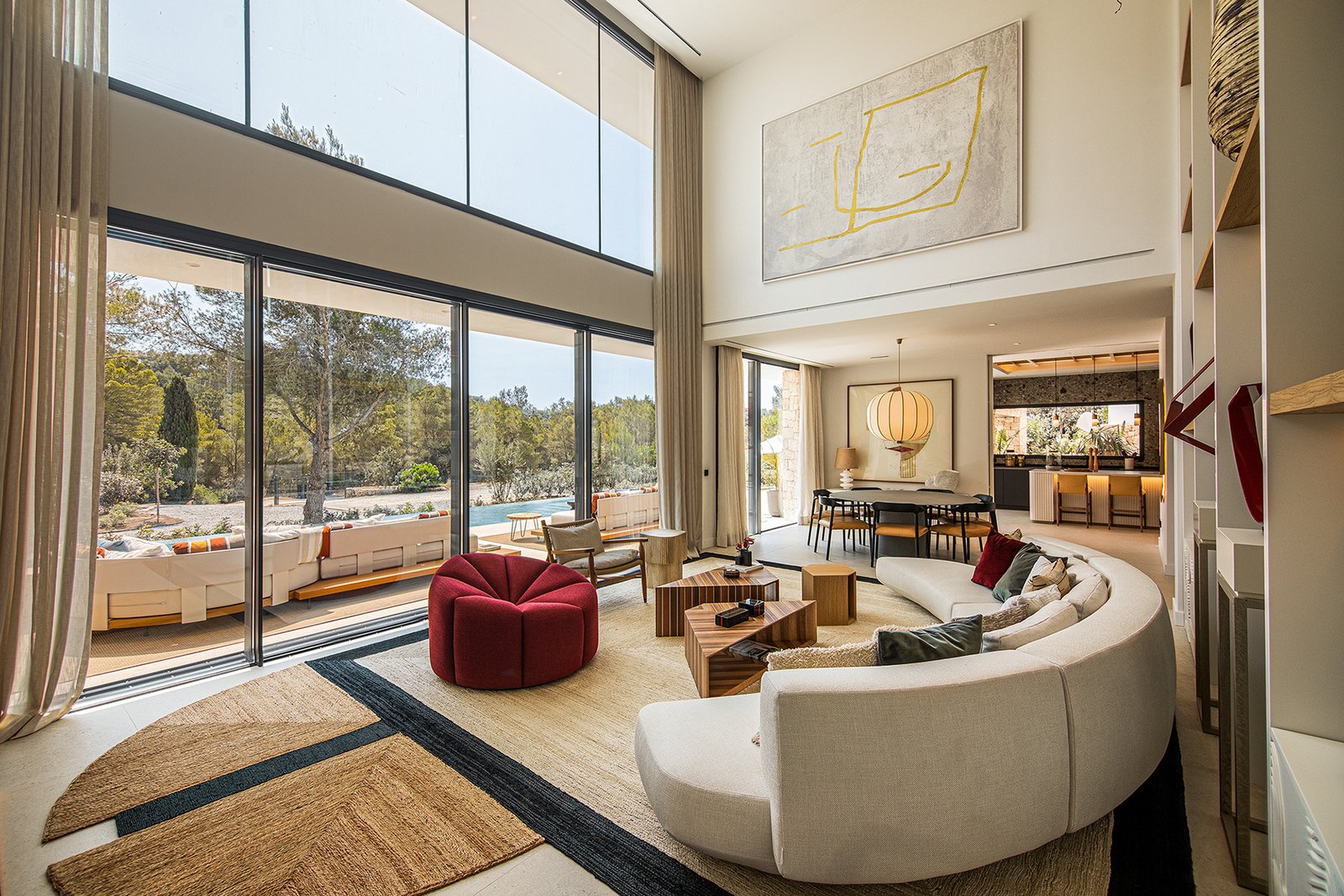 Luxury Ibiza villa living room with modern furniture and panoramic views.