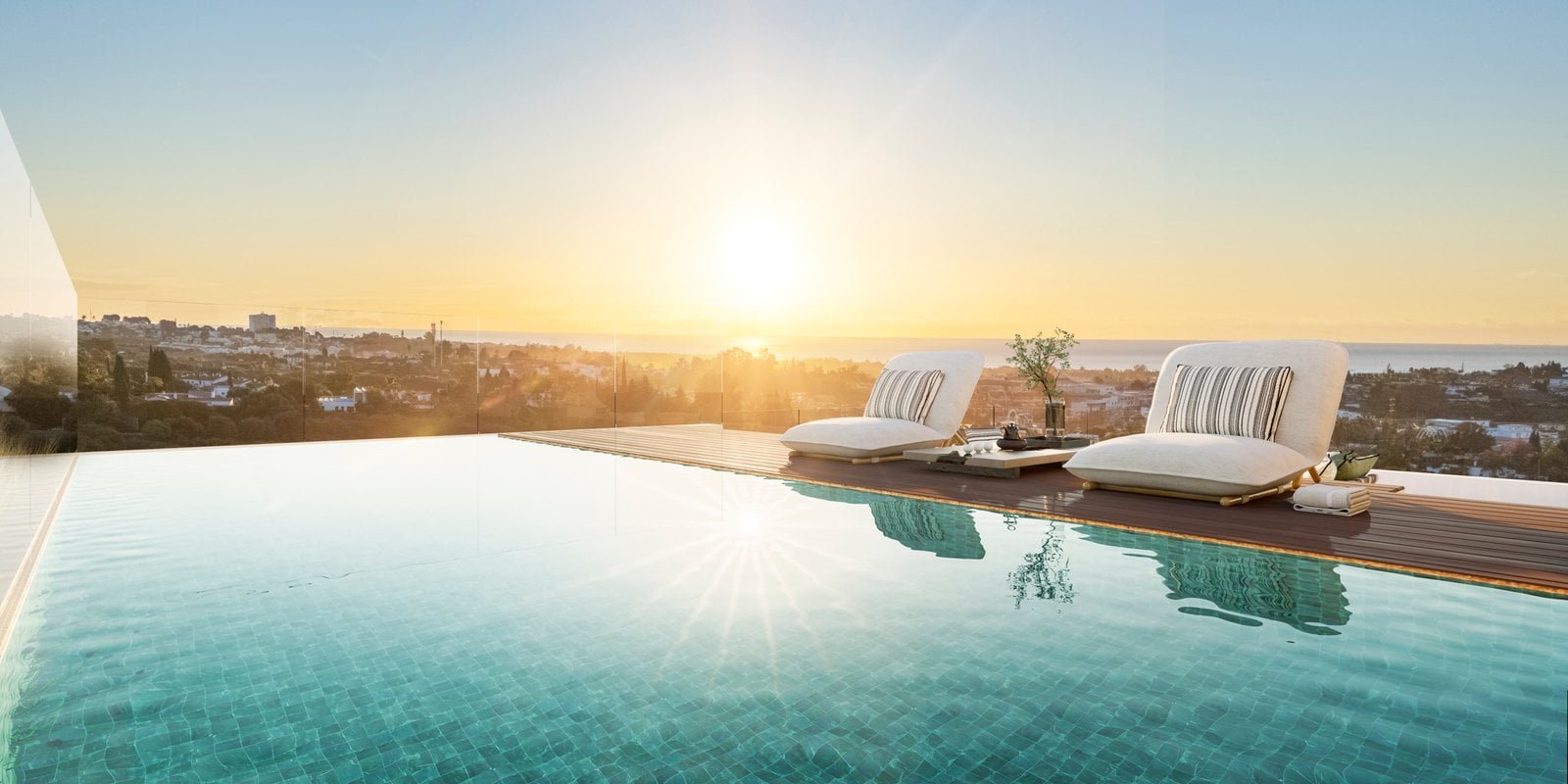 Luxury Marbella pool overlooking the sunset and cityscape. Perfect for relaxing and enjoying contemp.