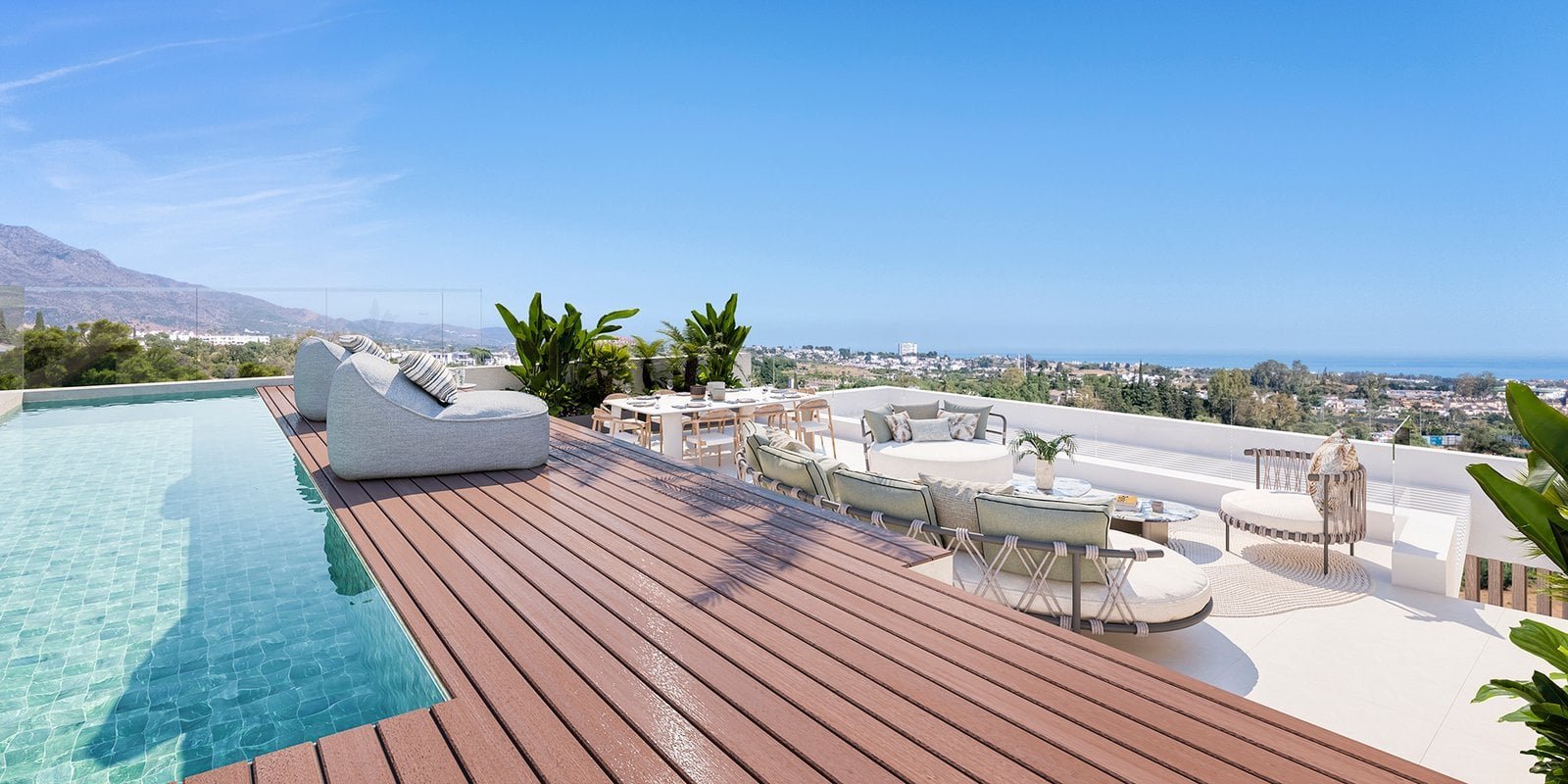Rooftop pool at Solenne Luxury Apartments Marbella with sea views and modern outdoor seating.