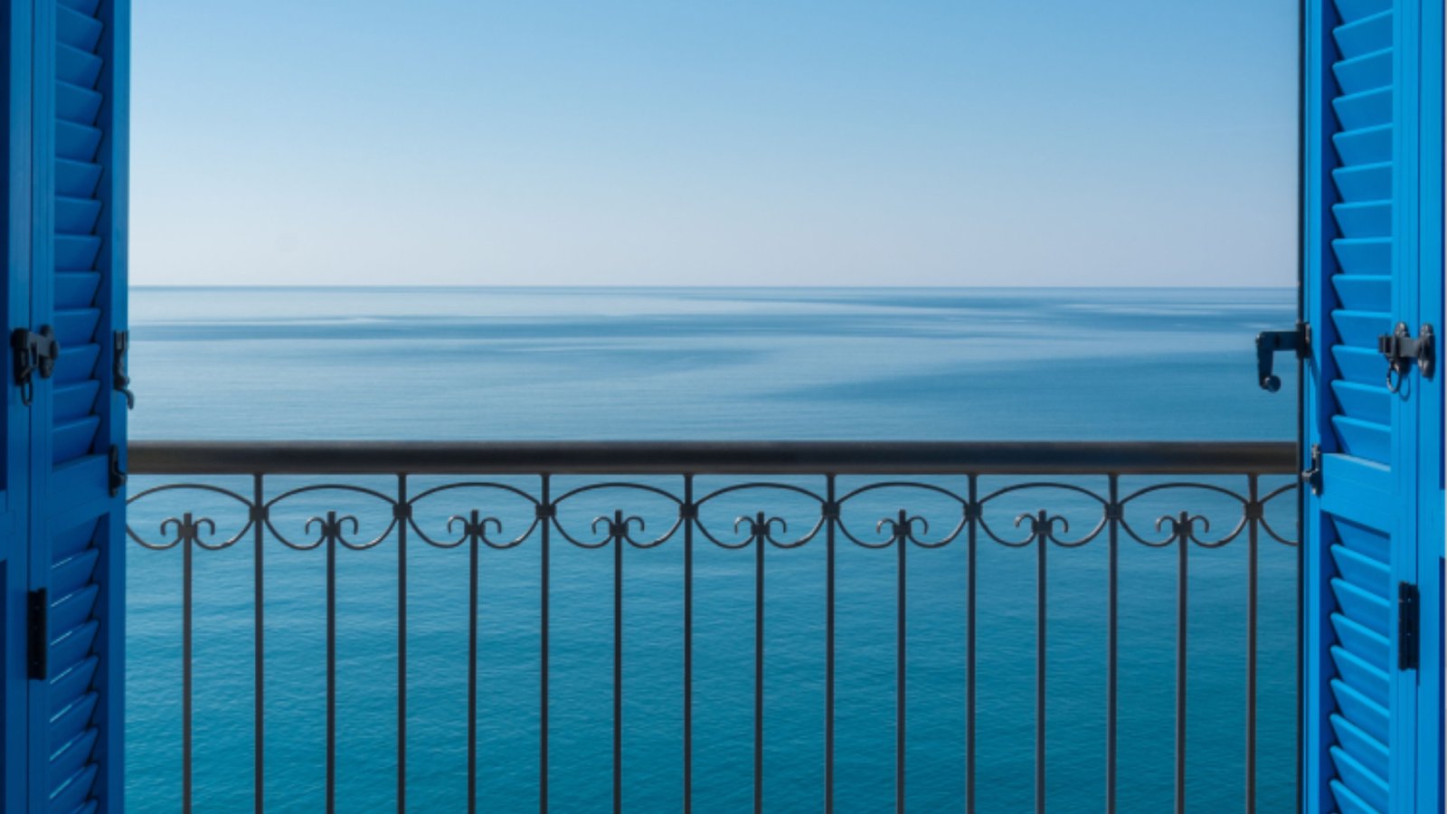 Stunning sea view from luxury Montenegro apartments with blue shutters.