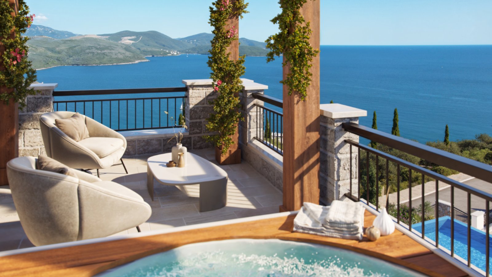 Balcony with sea view, outdoor seating, and hot tub in Montenegro luxury apartments.