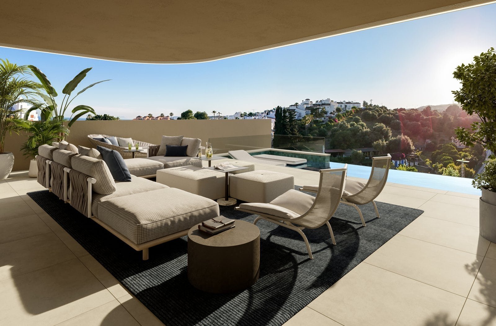 Elegant outdoor lounge area with modern furniture and scenic vistas in Beyond Homes Estepona.