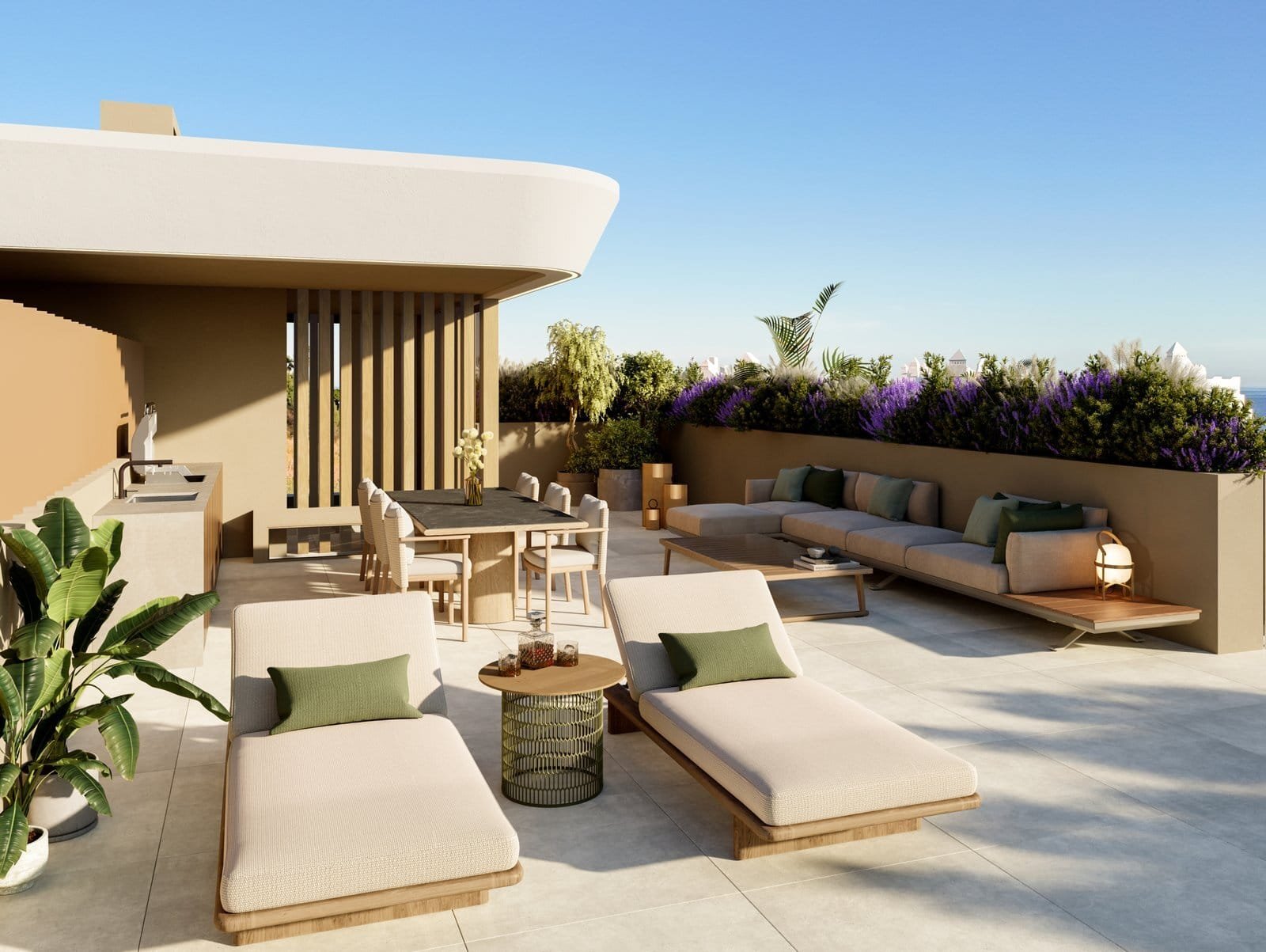 Elegant outdoor terrace featuring sun loungers, a dining area, and lush greenery in Estepona.