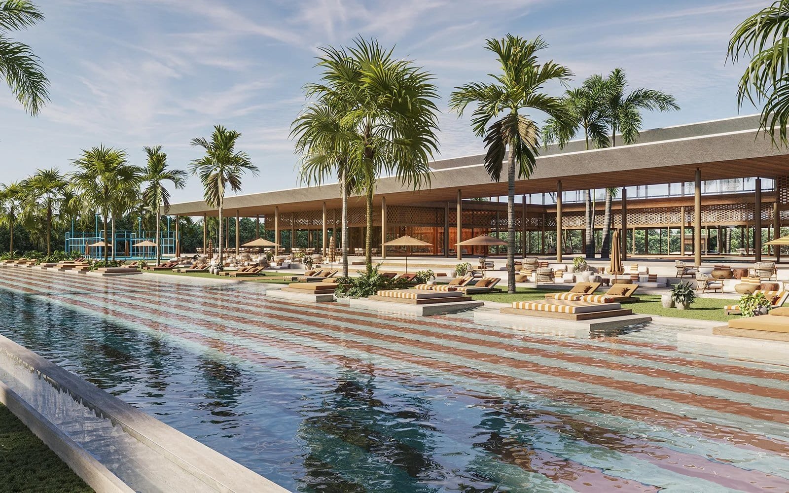 Luxury pool with palm trees and lounge chairs at La Reserva, Punta Cana, offering premium living and.