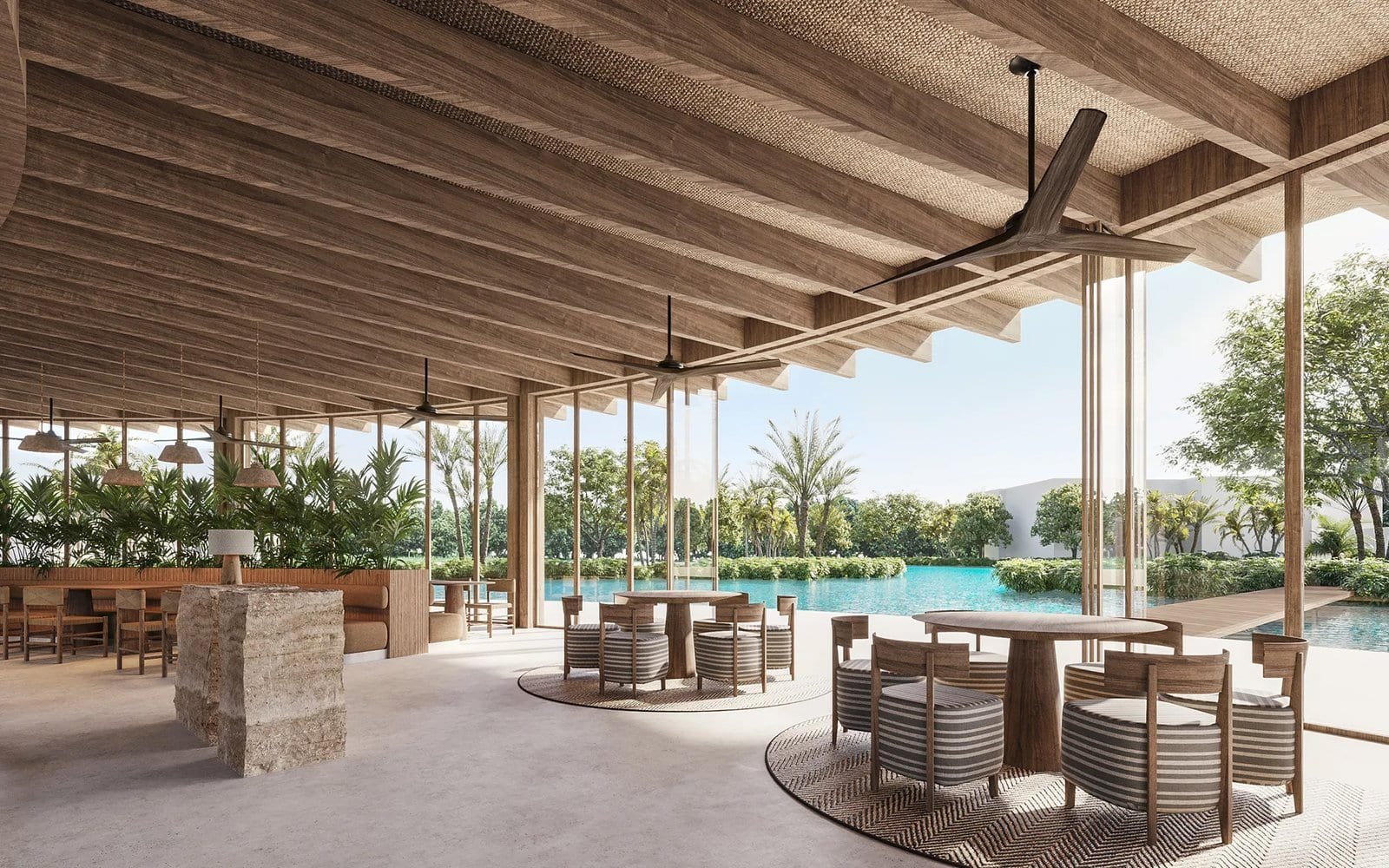 Elegant poolside lounge area with modern furniture and scenic views in La Reserva, Punta Cana.