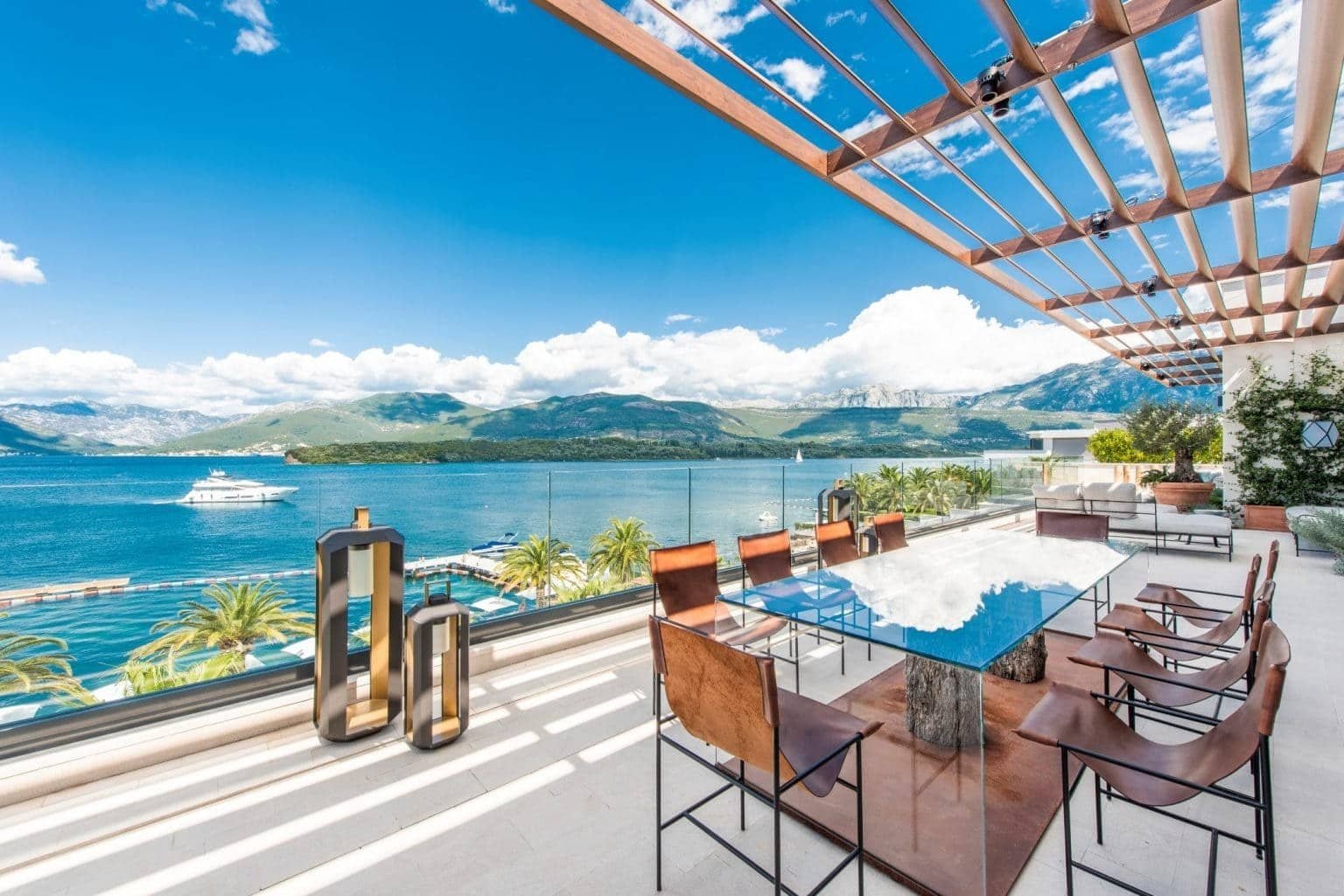Luxury waterfront penthouse with panoramic views of Tivat Bay and surrounding mountains.