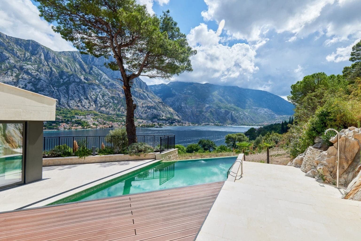 Sea view villa in Prčanj with infinity pool and mountain backdrop.