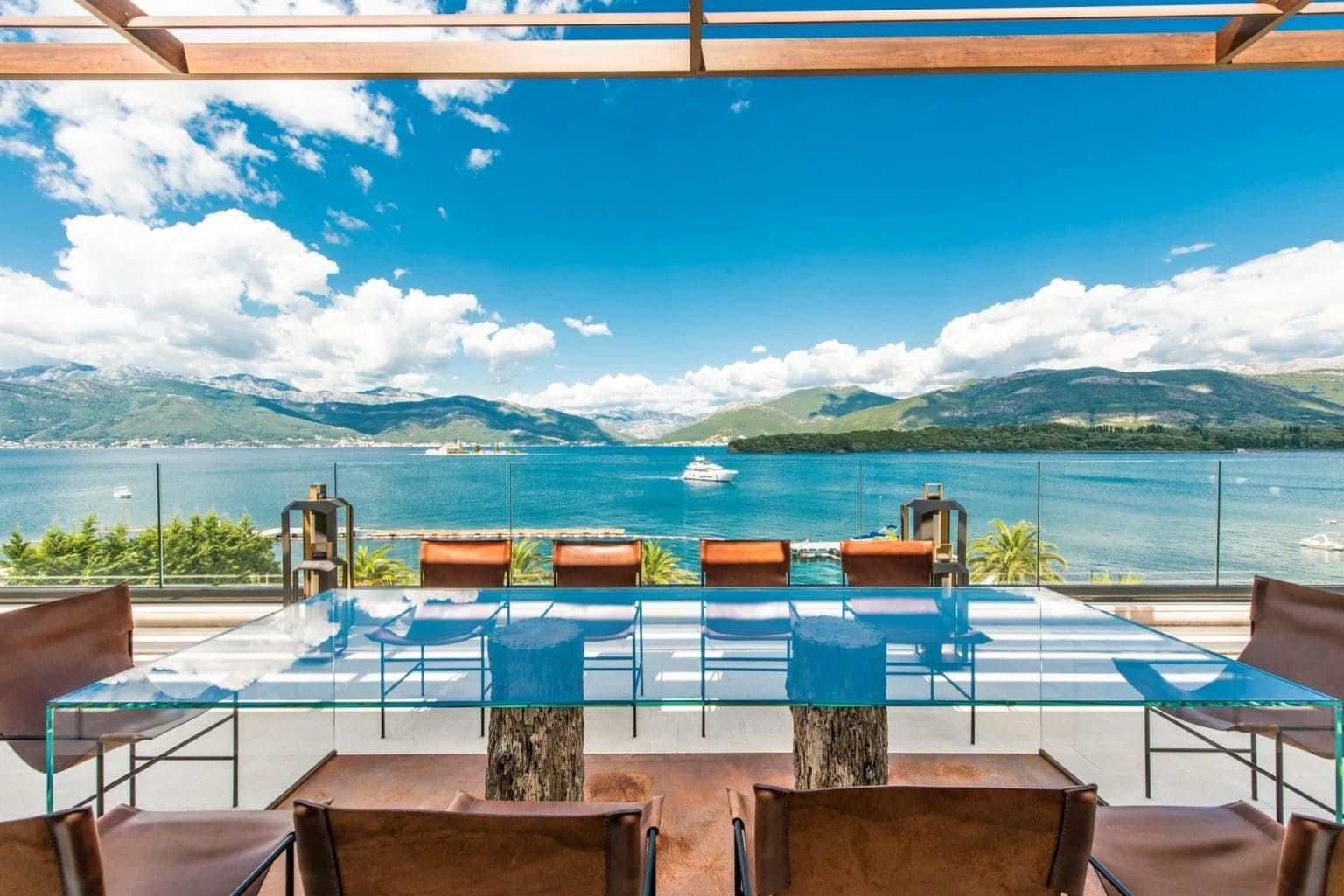 Waterfront penthouse terrace with stunning lake and mountain scenery in Tivat, Montenegro.