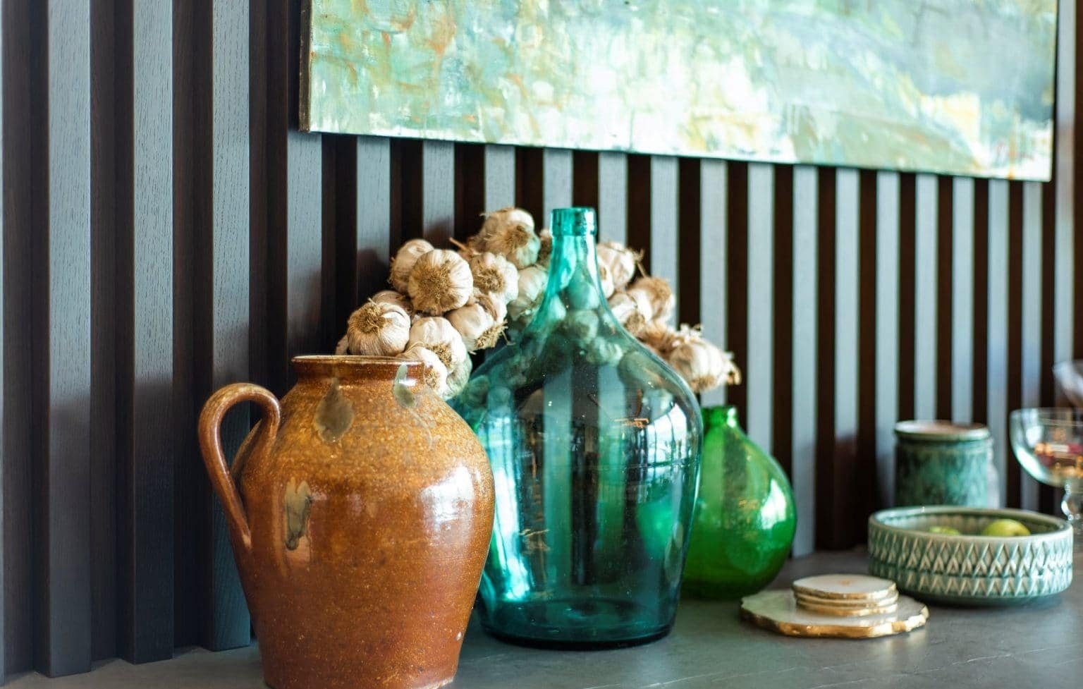 Elegant glass and ceramic vases in a luxurious waterfront residence.