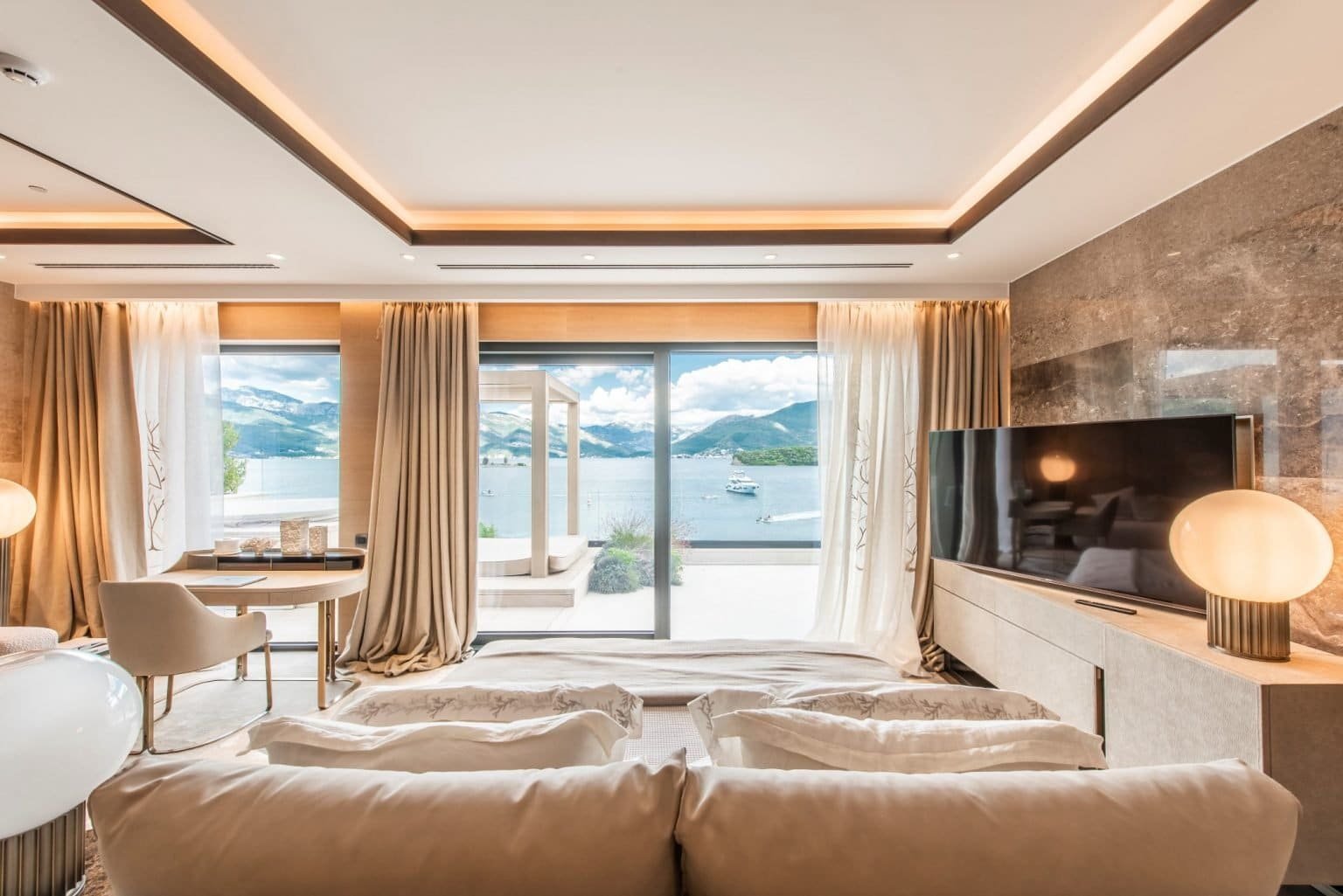 Waterfront penthouse with stunning views of Nikki Beach Montenegro, modern interior, and spacious li.