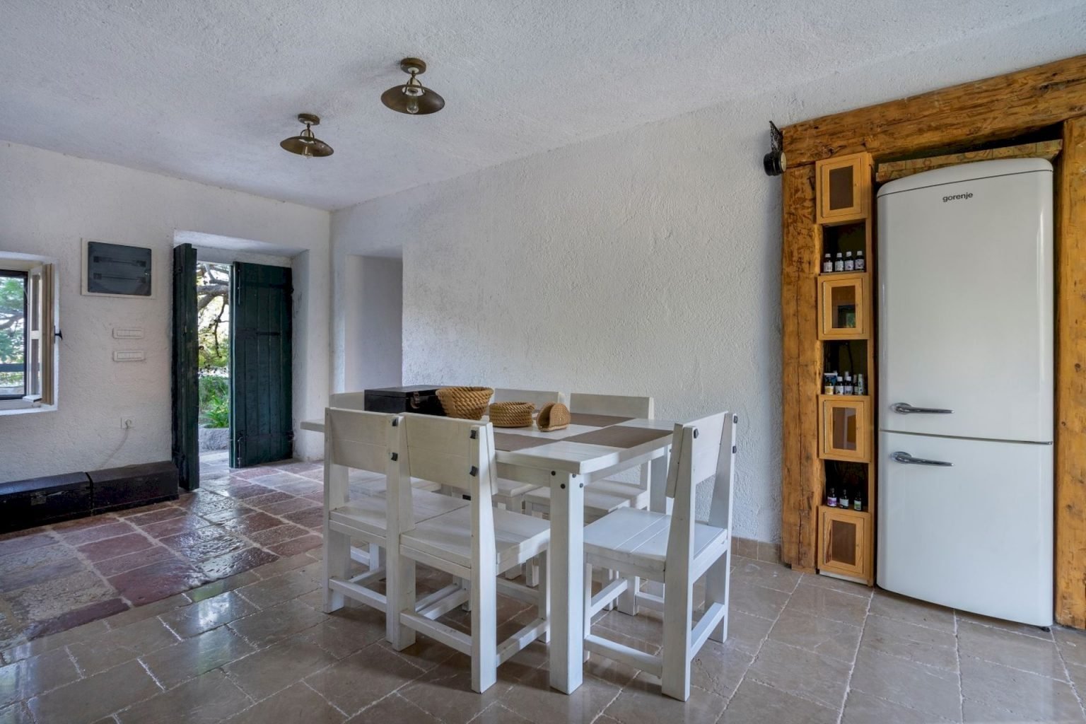 Interior view of a Montenegro estate with a dining area and modern appliances.
