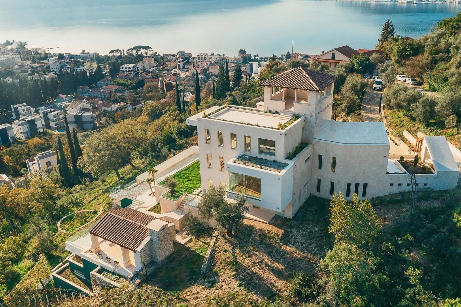 Luxury hillside villa with panoramic sea views in a scenic coastal location.