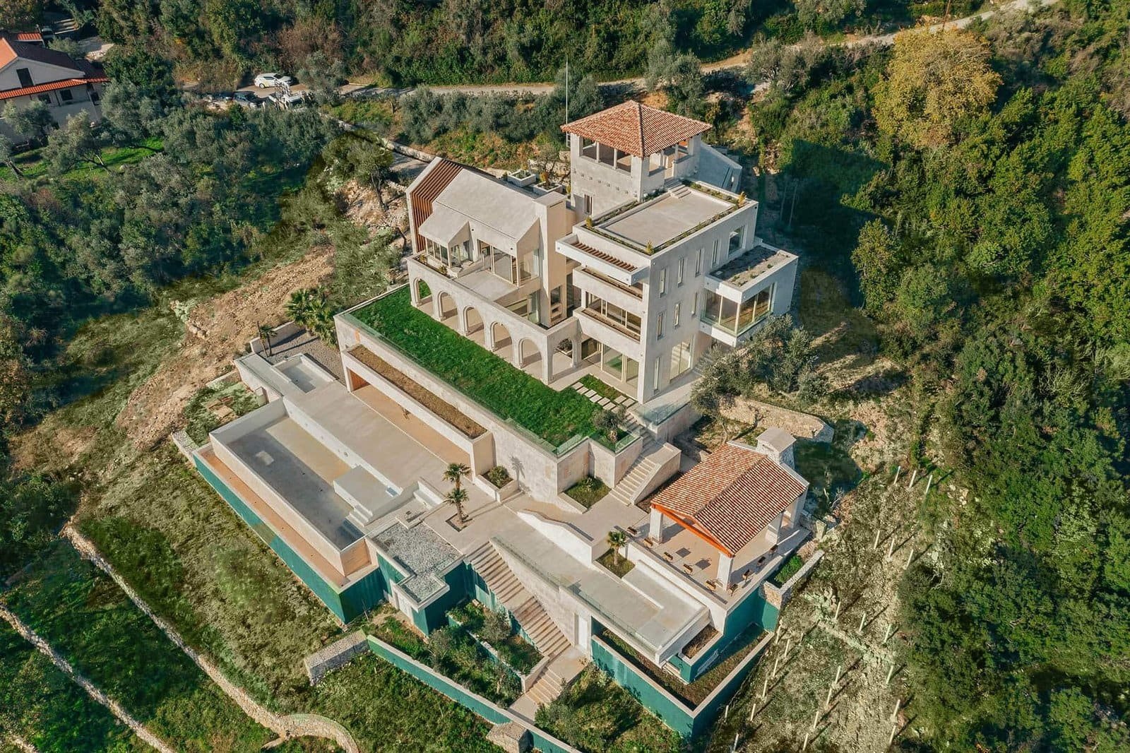 Luxury hillside villa with modern architecture in Greece.
