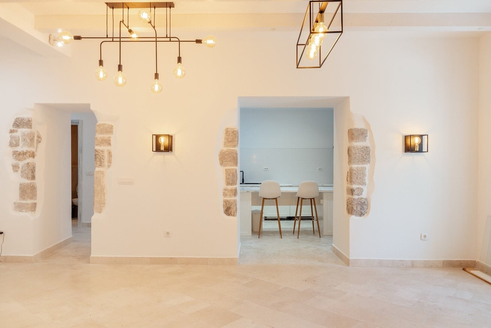 Elegant interior featuring stone wall accents and contemporary lighting fixtures.