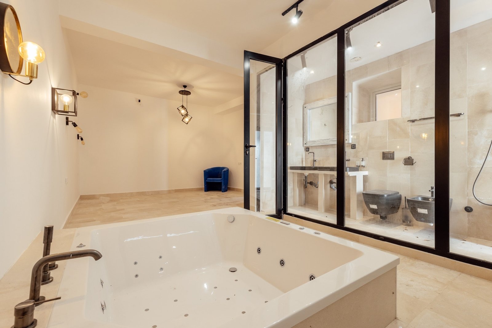 Luxury bathroom featuring a Jacuzzi tub and a modern glass-enclosed shower for relaxation and style.