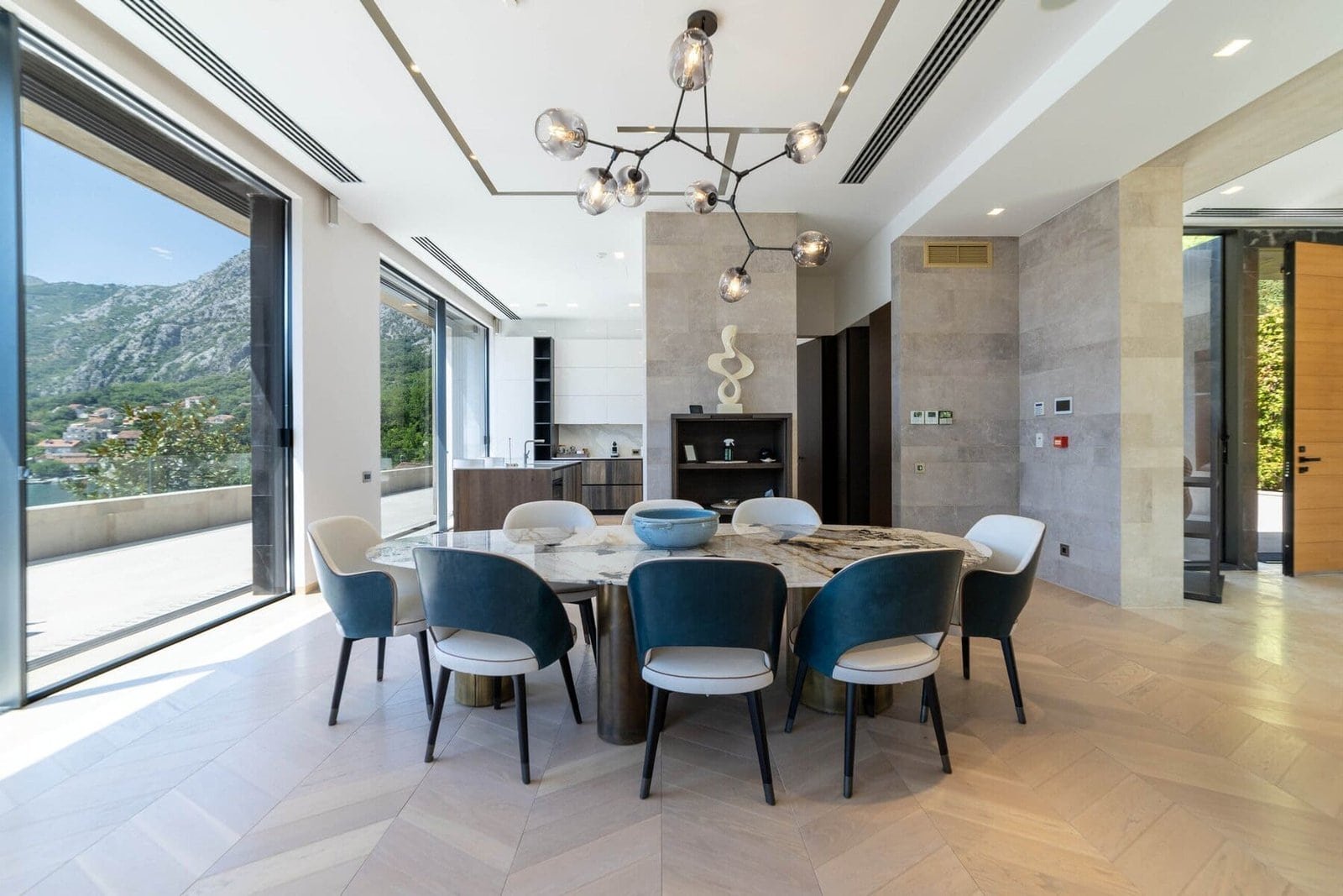 Elegant dining room featuring large windows and scenic mountain views, perfect for upscale events an.