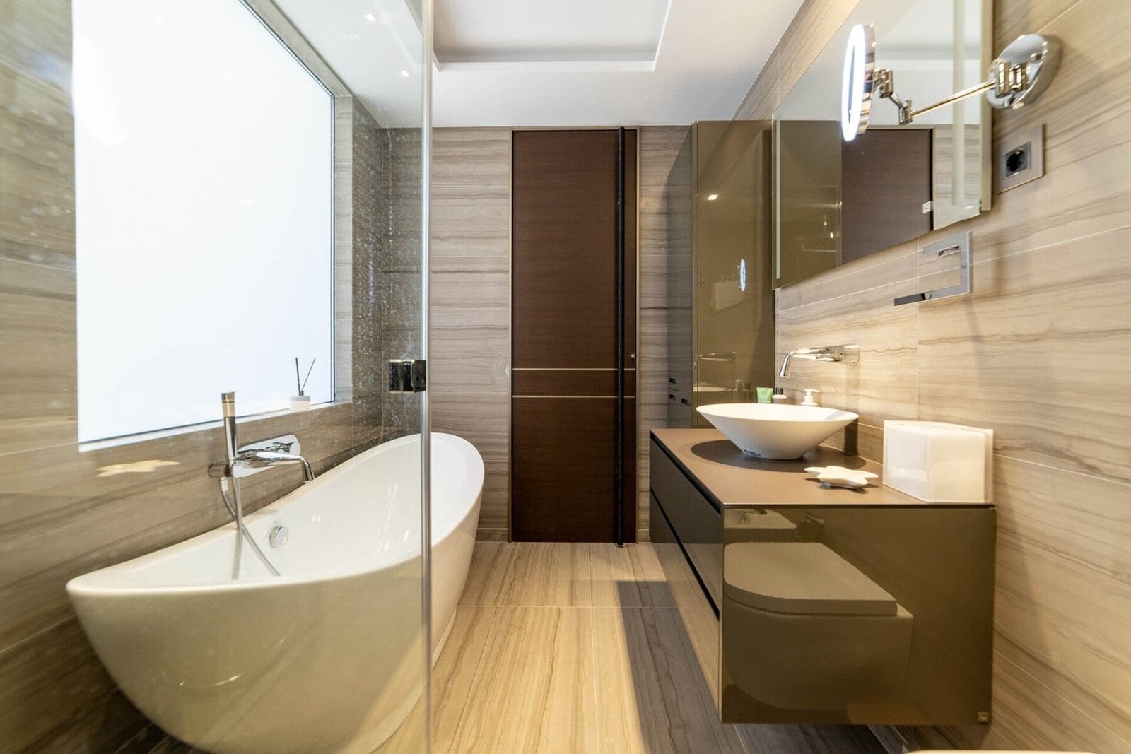 Elegant bathroom featuring a freestanding bathtub and contemporary vanity design.