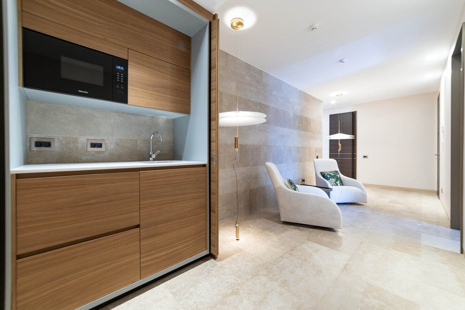 Elegant hotel lounge with comfortable chairs and stylish interior design.